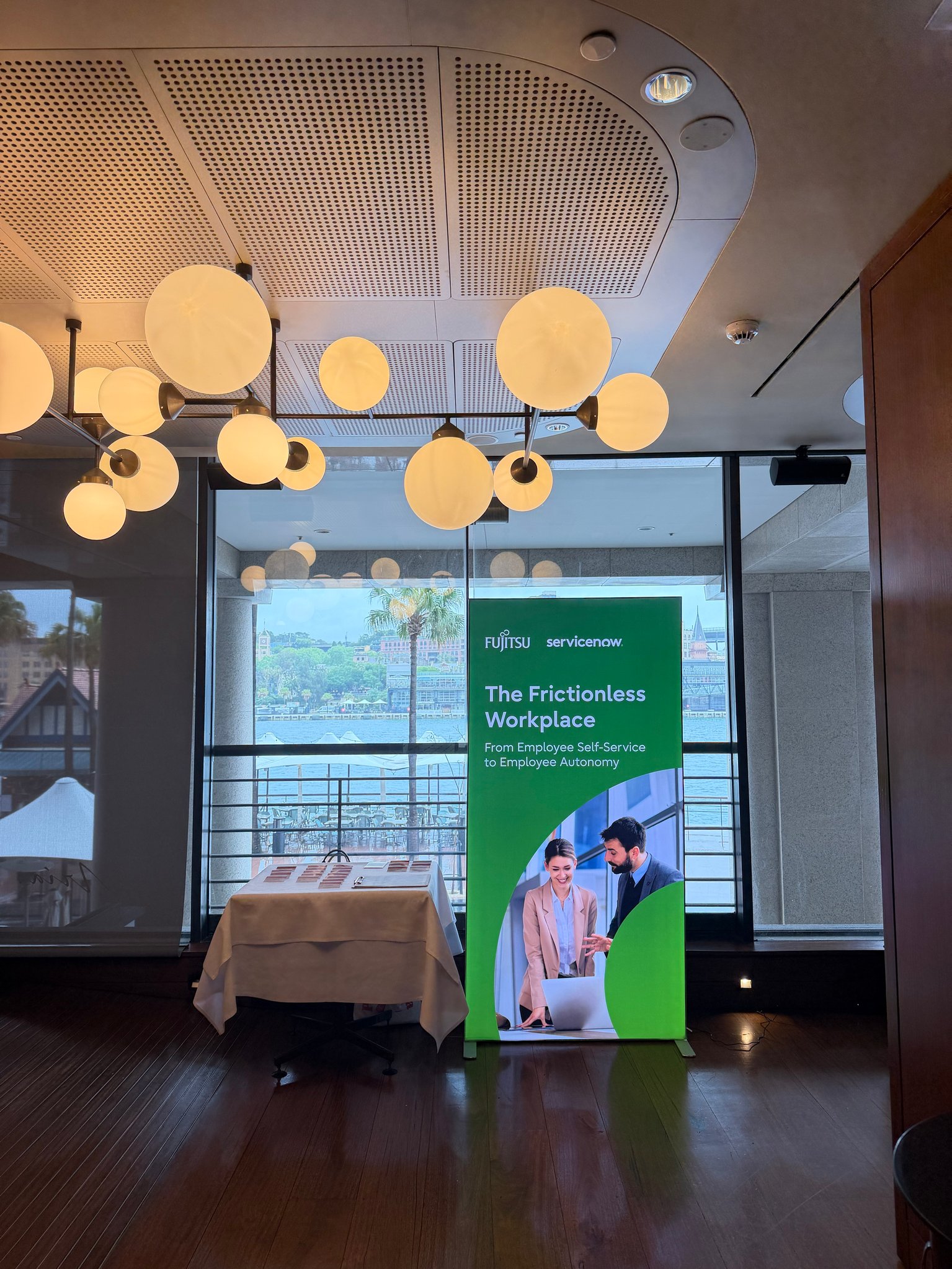Green Fujitsu and ServiceNow freestanding event sign